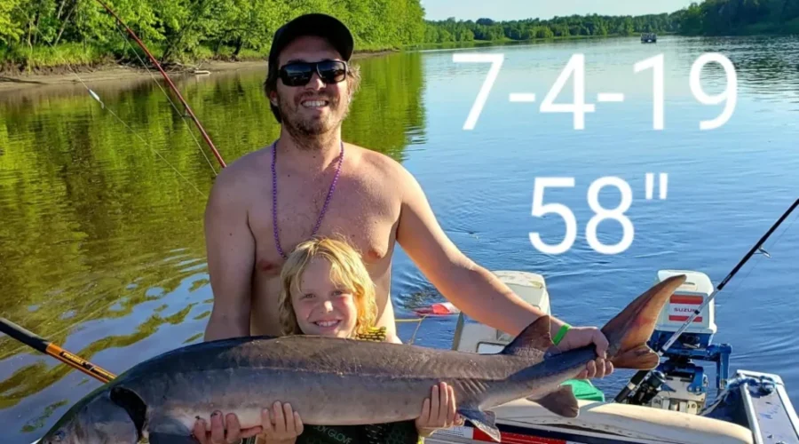 Lincoln Knutson fishing Rainy River with his dad, AJ