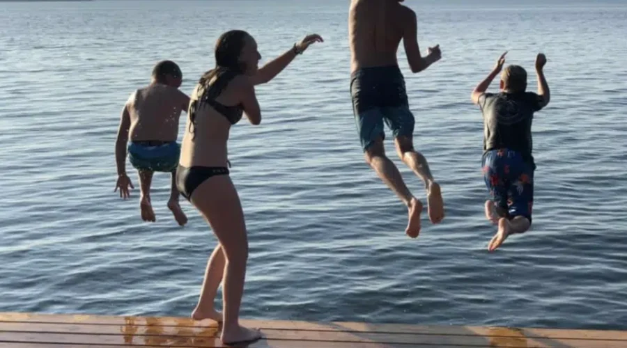 Kids jumping into Rainy Lake!