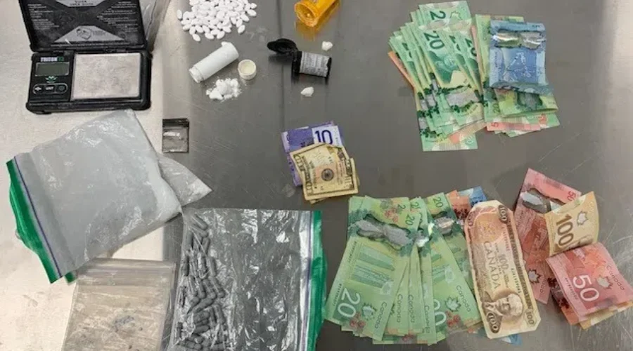 Two Charged After Police Find Drugs/Cash