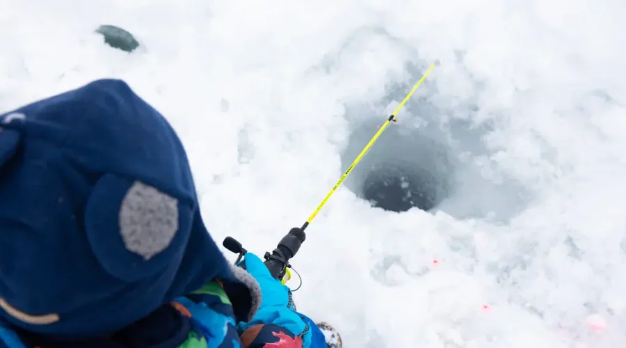 Local Communities Competing In Ice Fishing Challenge