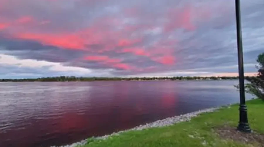 Pink Clouds Reflected In The Water